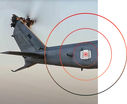 A square antenna panel (FIRST RF's FRF-258 - Full Motion Video Antenna System ) is shown mounted to the side of a helicopter tail while the vehicle is mid-flight. There are radial red waves expanding out from the center of the antenna.